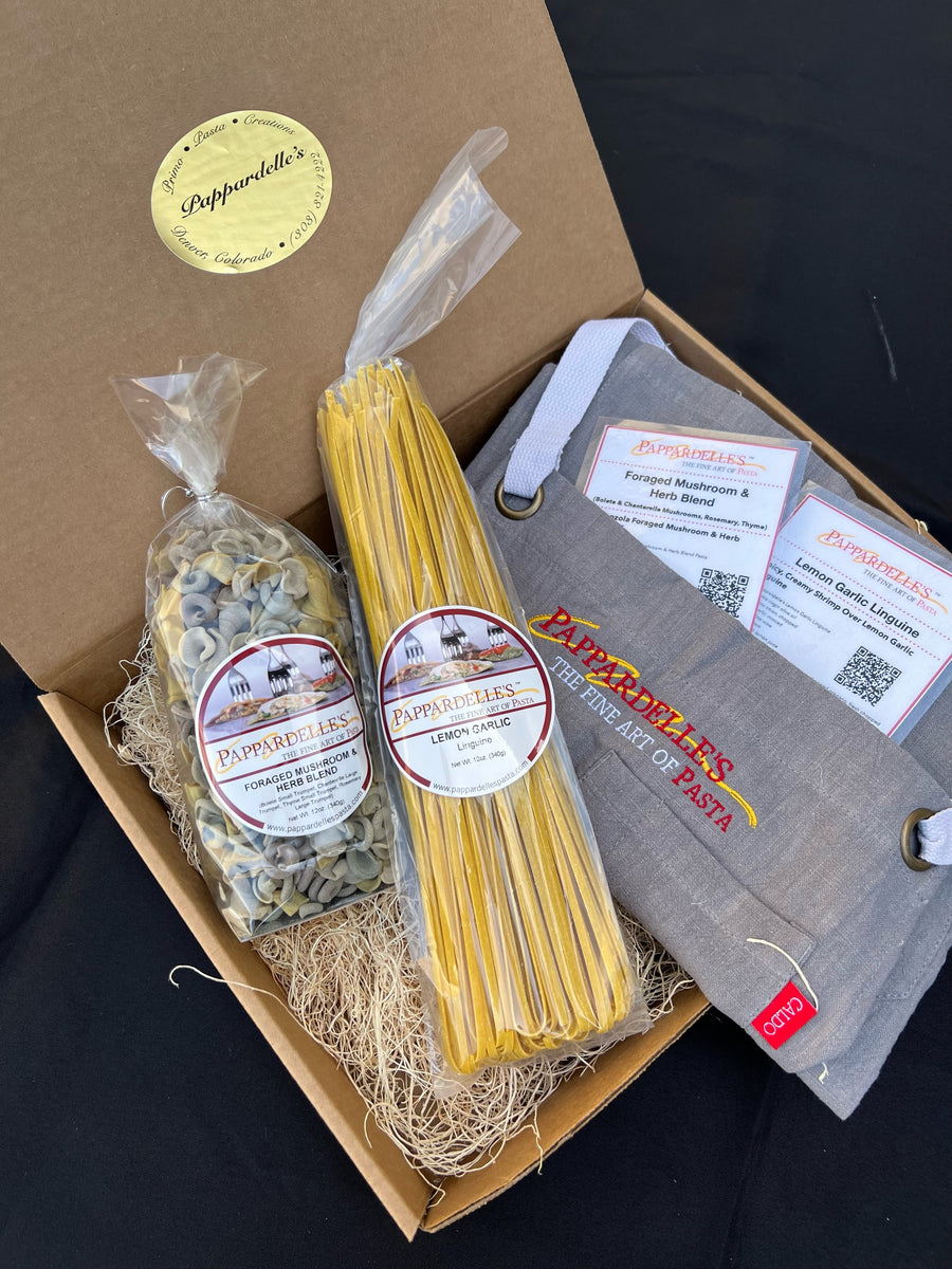 Pasta of the Month club mystery box with sealed pasta packets and spaghetti noodles